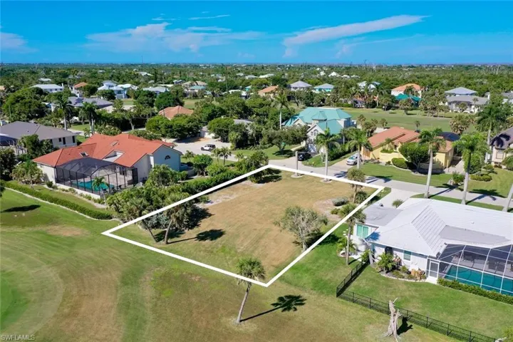 Aerial perspective of suburban area with property parcel outlined