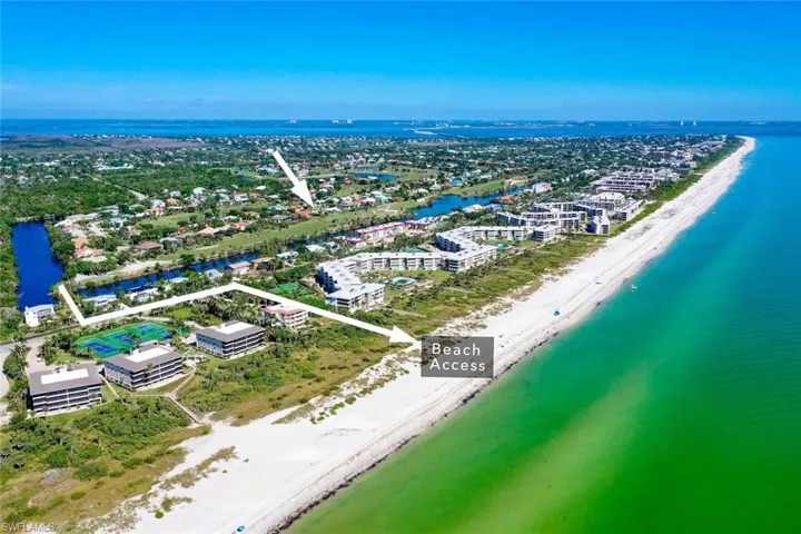 Aerial overview of property's location featuring expansive beach and property boundaries highlighted