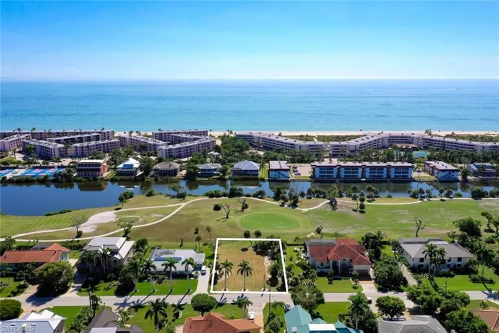 Aerial overview of property's location with property parcel outlined, a golf course, and a nearby body of water