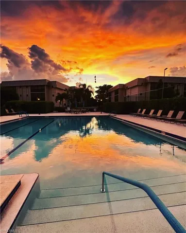 Huge Community pool with a sunset view