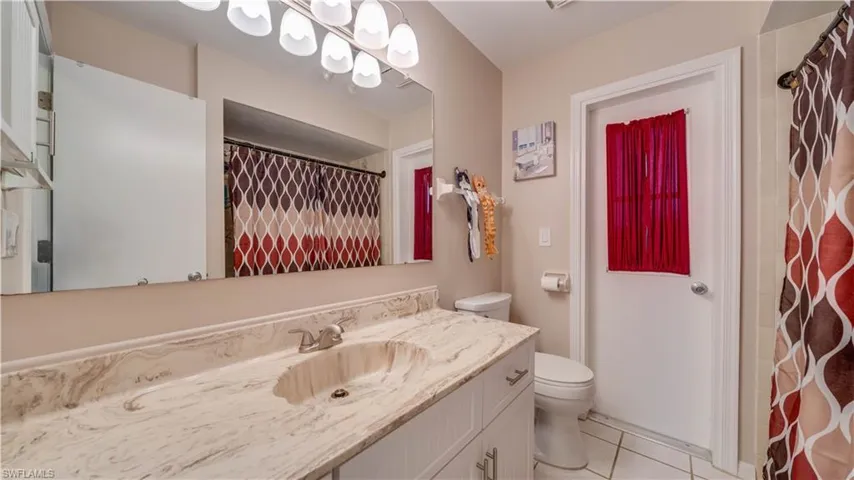 Guest bathroom with access to interior hallway & bonus/Florida room