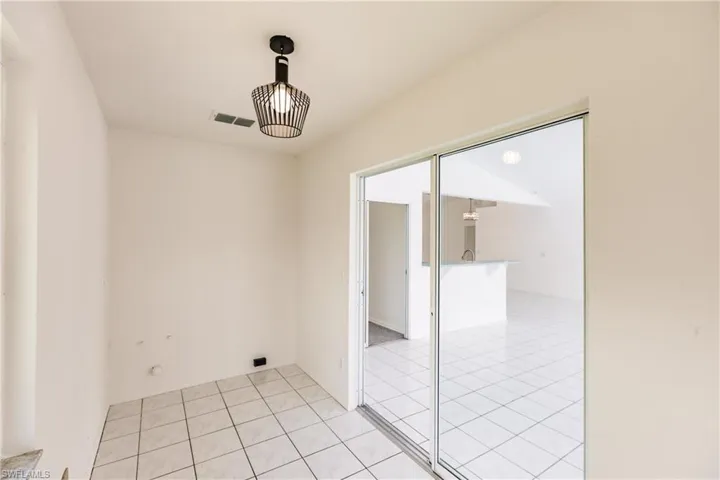 Spare room with light tile patterned floors