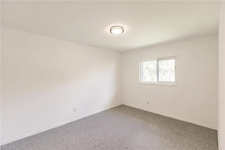Spare room featuring carpet floors