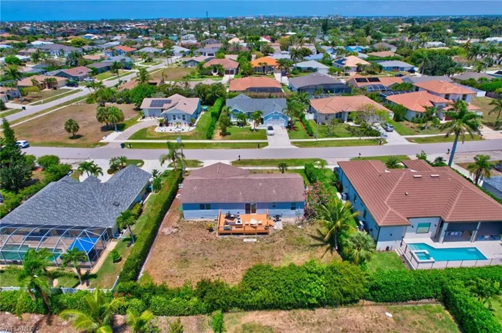 Birds eye view of property with a residential view