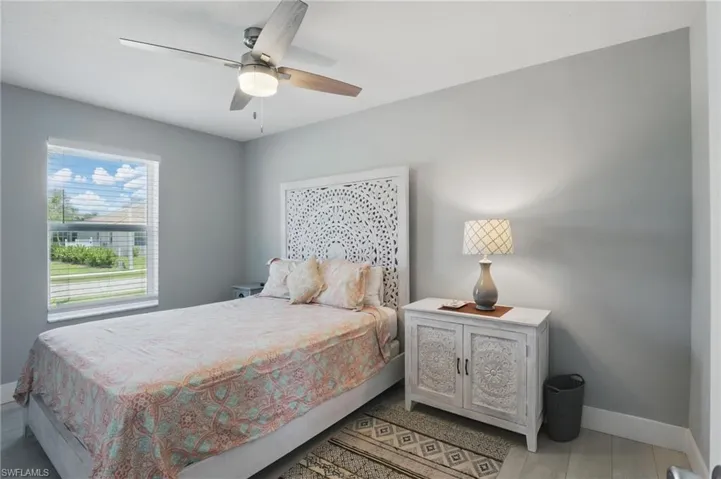 Bedroom with baseboards and ceiling fan