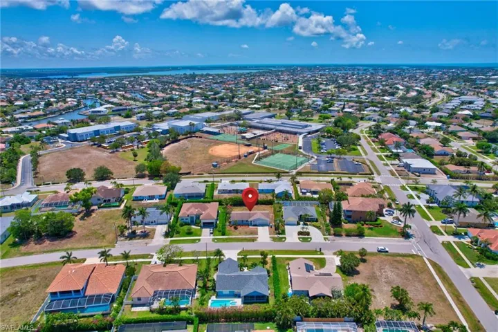Aerial view with a water view and a residential view
