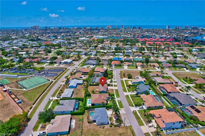 Aerial view featuring a city view, a water view, and a residential view