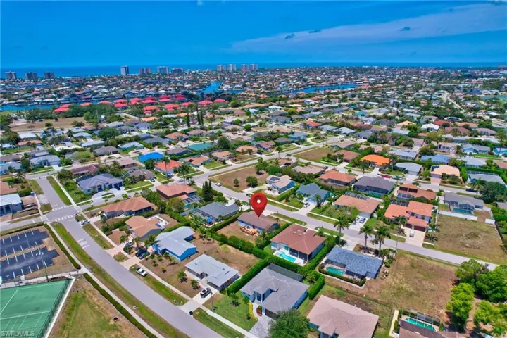 Drone / aerial view with a water view, a residential view, and a view of city