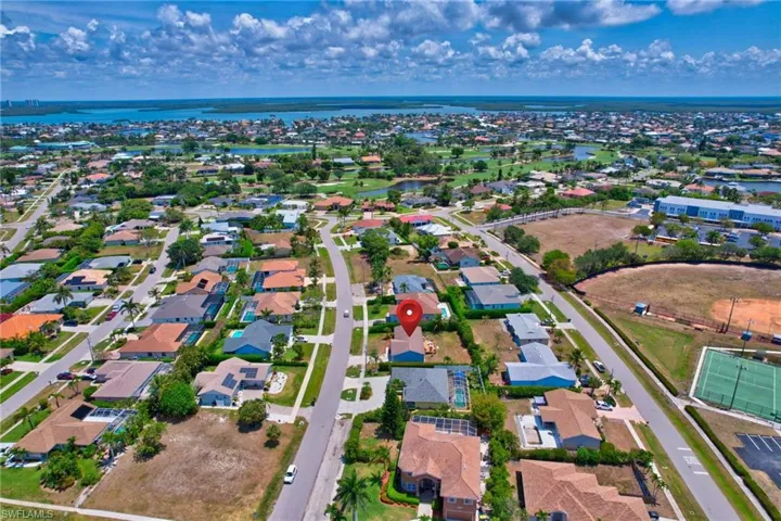 Aerial view featuring a water view and a residential view