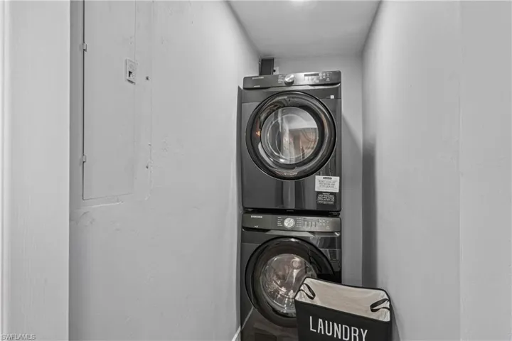 Washroom with stacked washer / dryer