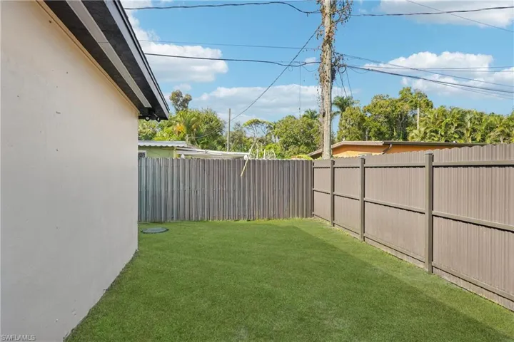 View of fenced backyard
