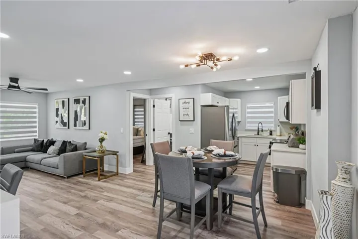 Dining room featuring light wood-style floors, recessed lighting, and a chandelier
