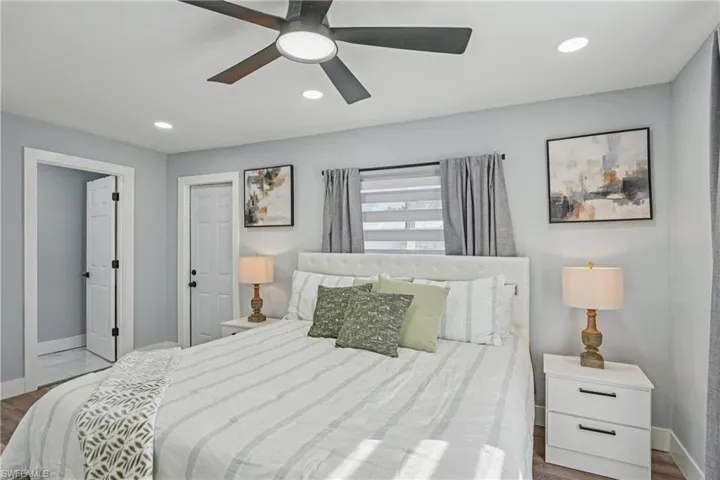 Bedroom featuring recessed lighting, a ceiling fan, and wood finished floors
