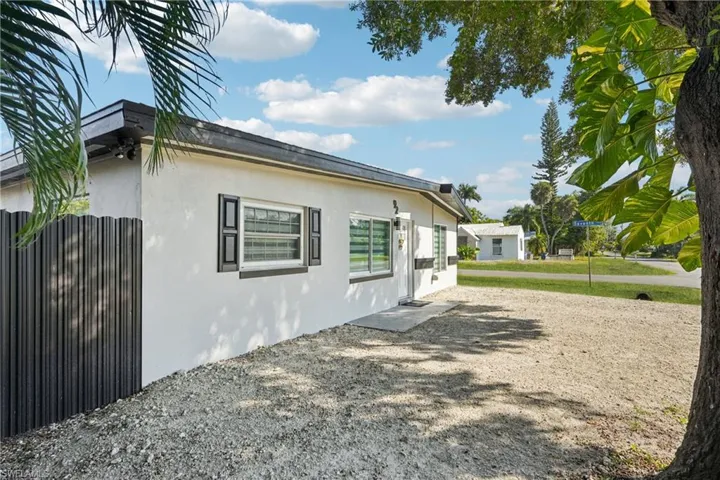 View of side of home with stucco siding
