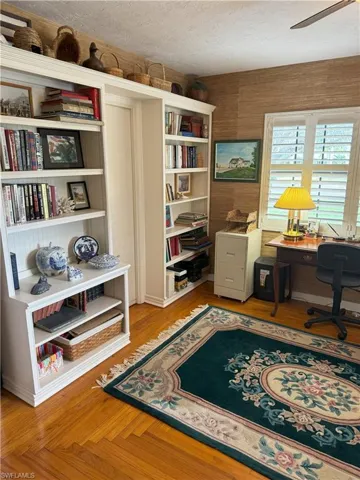 Office area featuring a textured ceiling and light parquet flooring