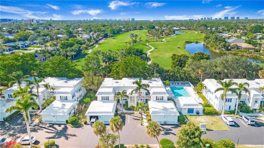 Drone / aerial view featuring a water view and golf course view.