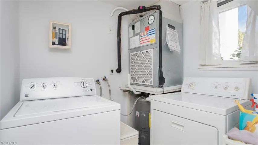 Washroom featuring washing machine and clothes dryer
