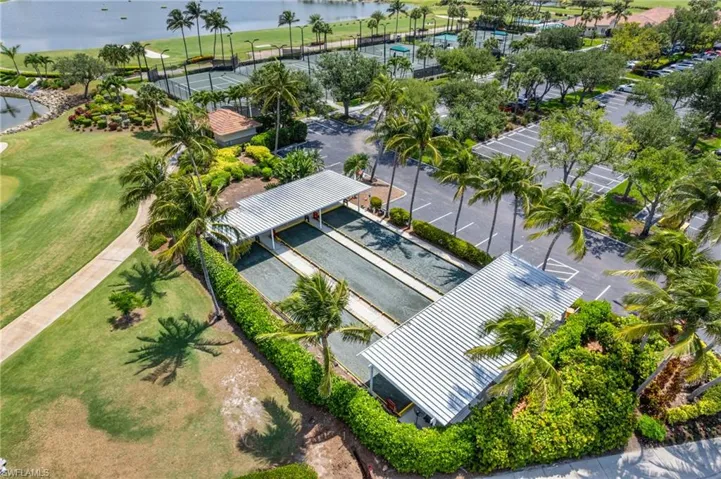 Drone / aerial view of a nearby body of water and a local golf course