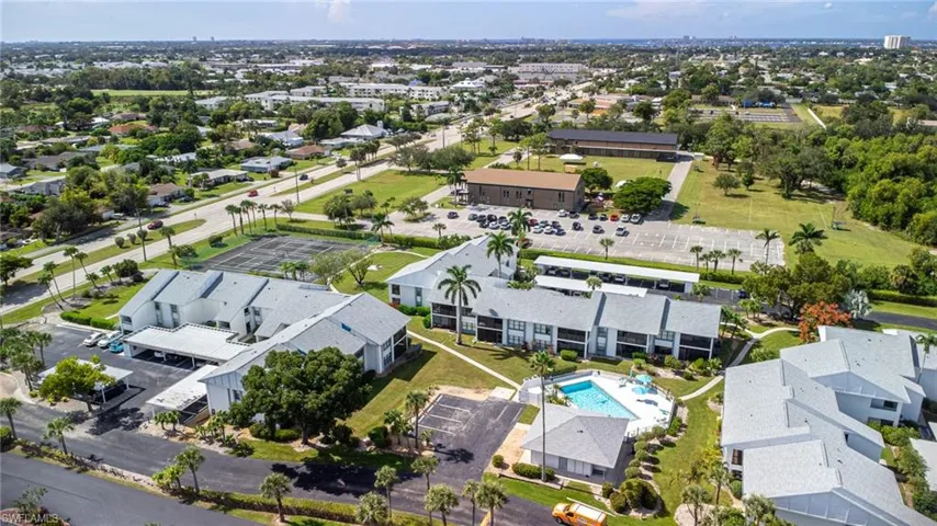Aerial perspective of suburban area featuring a pool