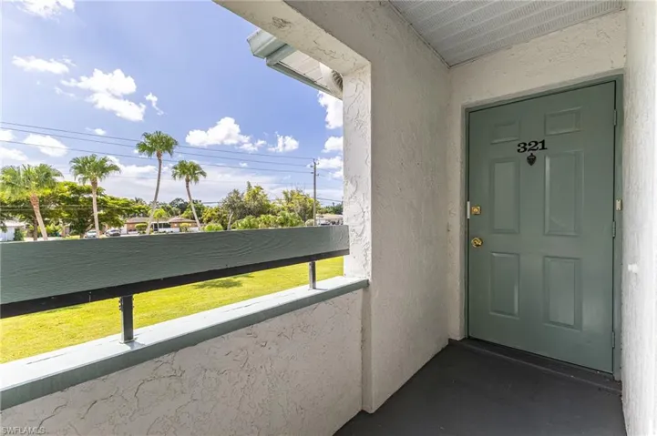 View of exterior entry featuring stucco siding