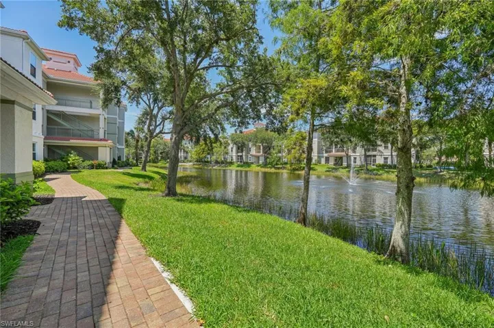 View of yard with a water view