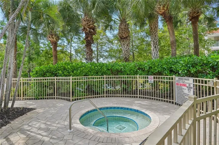 View of pool featuring a hot tub