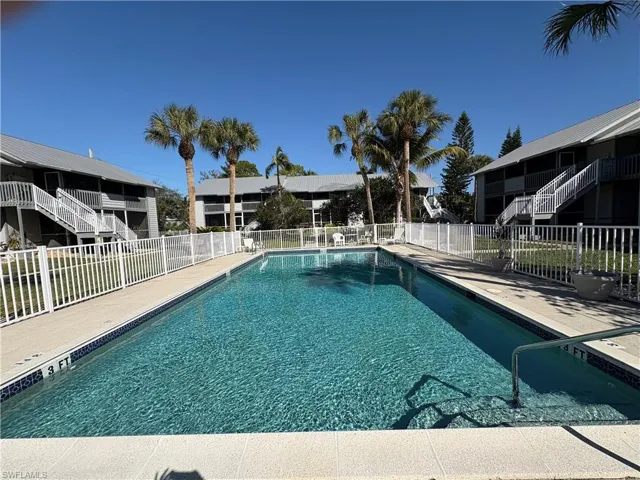 Community pool featuring a patio