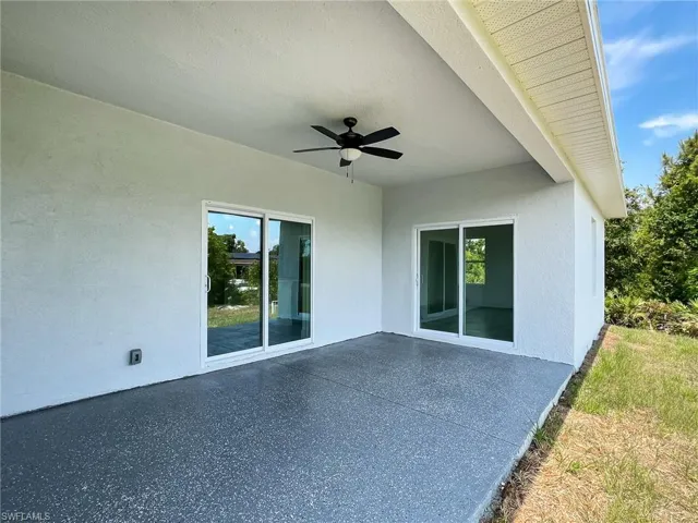 View of patio with ceiling fan