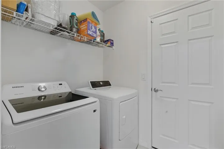 Laundry room featuring washing machine and clothes dryer