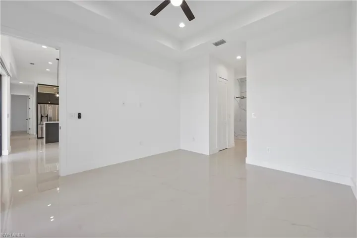Spare room featuring visible vents, recessed lighting, marble finish floor, and baseboards