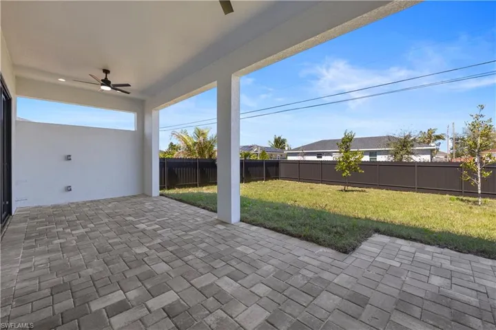 View of patio / terrace with a fenced backyard and ceiling fan