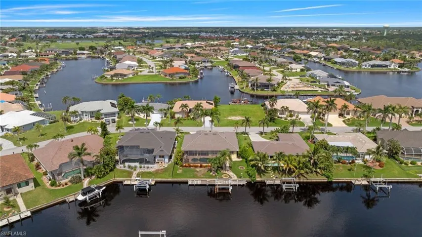 View of property location with a large body of water and nearby suburban area