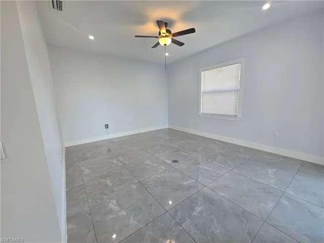 Spare room with recessed lighting and ceiling fan