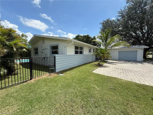Front yard of the house with fenced side-and backyard