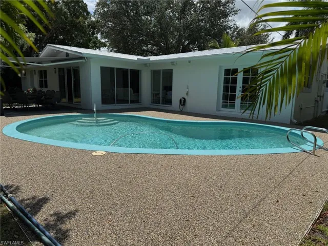 Swimming pool featuring new pool deck