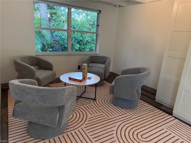 Multifunction game room featuring laminate wood finished floors