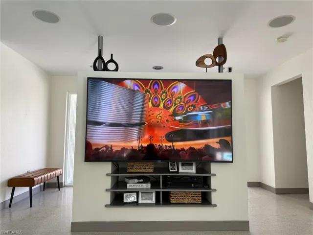 Build-in unit in living room with dolby 5.1 surround speakers and 75" Sony TV