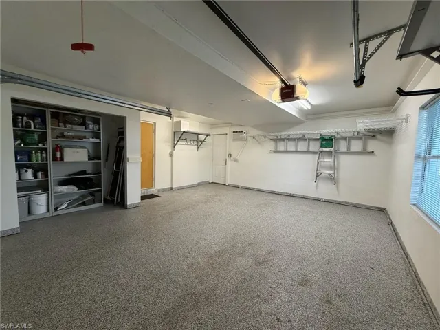 Garage with epoxy flooring and a wifi-connected garage door opener