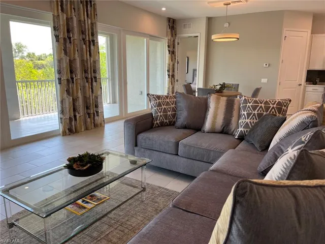 Living room featuring recessed lighting, visible vents, and tile patterned floors
