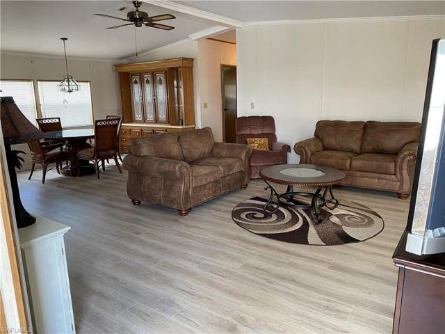 Looking in from the front door. Kitchen is to the left, hallway to office & bedrooms is on the right.