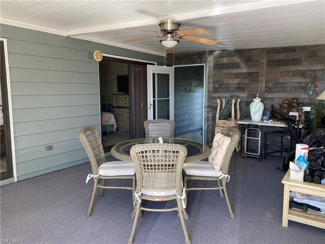 Laundry room and storage room are through the screen door. Guest bedroom has a slider to the lanai