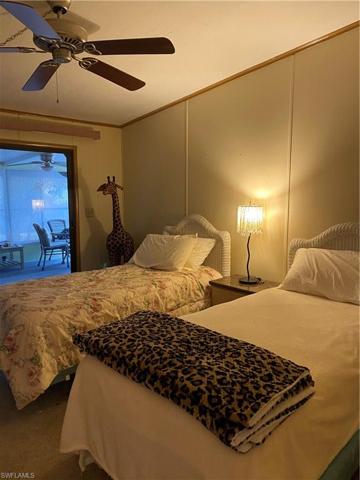 Guest bedroom with slider to Florida room