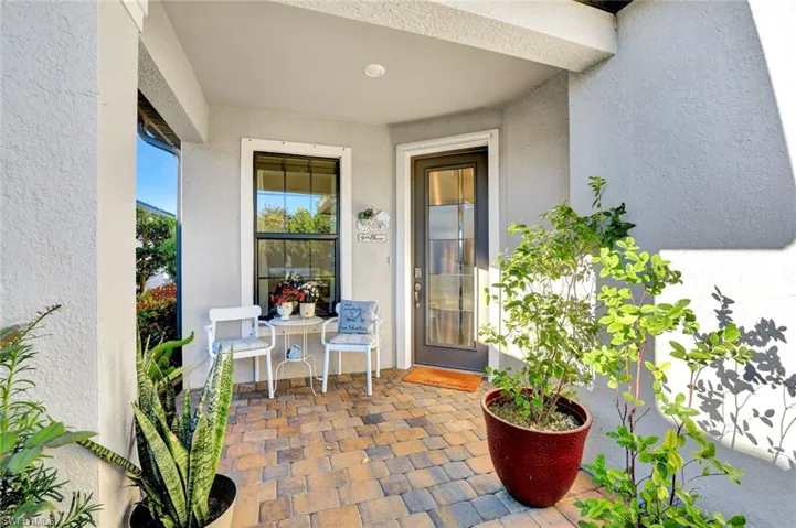 Property entrance with a patio area