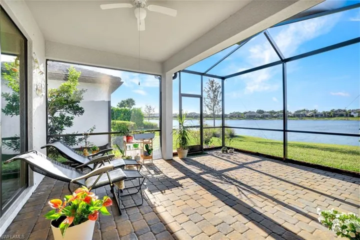 Sunroom with a water view and plenty of natural light
