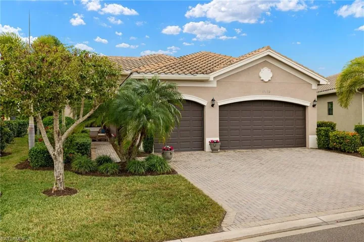 Mediterranean / Modern house with a front lawn and a garage