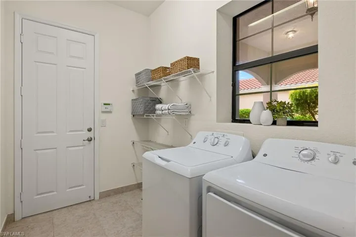 Bright and sunny Laundry area with independent washer and dryer