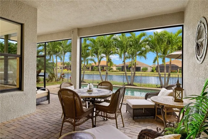 Sunroom / solarium featuring  panoramic screen for a sunset water view