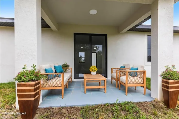 Doorway to property with an outdoor hangout area and a patio area