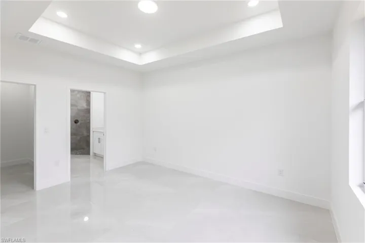 Empty room with a raised ceiling