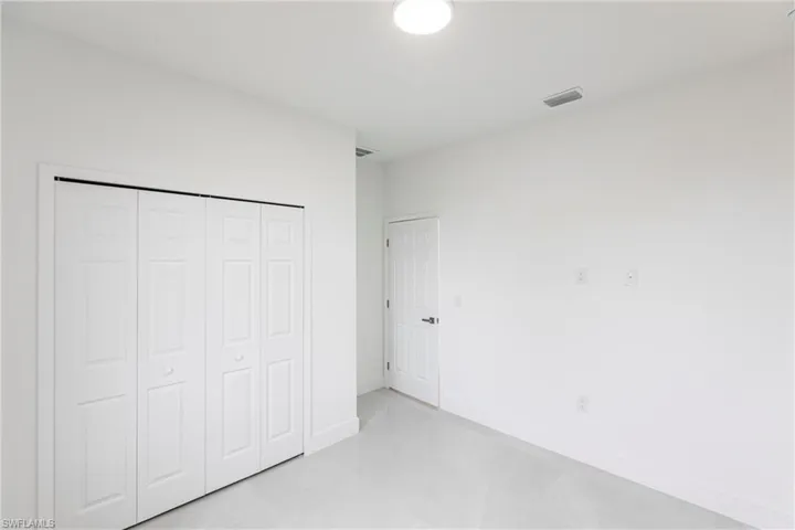 Unfurnished bedroom with a closet
